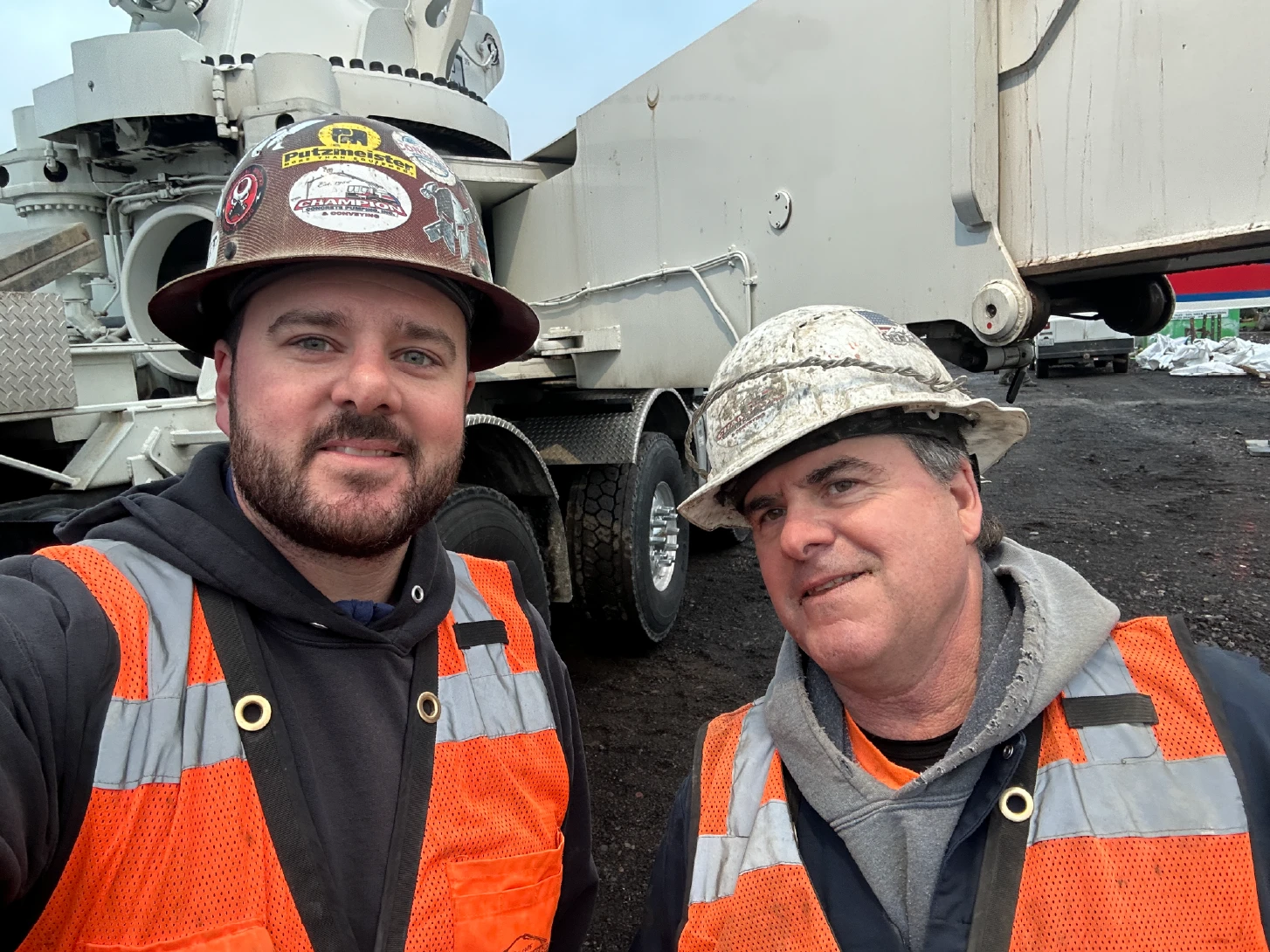 Two employees in hard hats